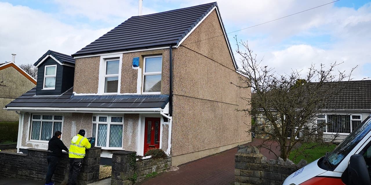 Suburban home facade - wall coating, QES Exteriors